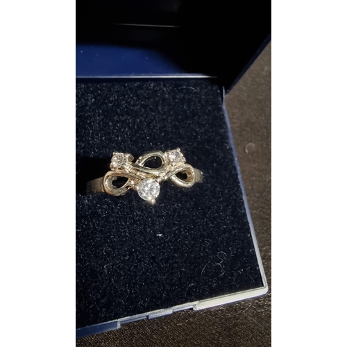 281 - 925 silver ring inset with three CZ stones in excellent clean condition marked 925 size P1/2 boxed