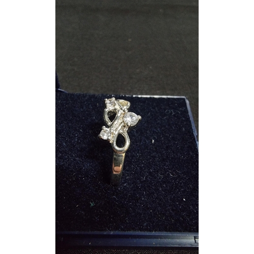 281 - 925 silver ring inset with three CZ stones in excellent clean condition marked 925 size P1/2 boxed