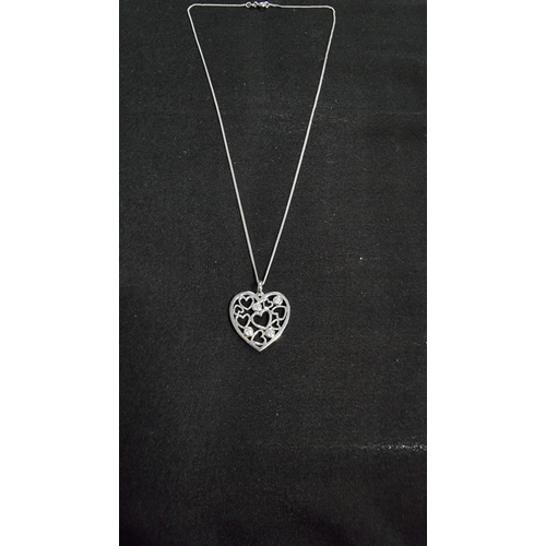 288 - 925 silver heart pendnat with 4 cz stones set on an 18 in 925 silver chain in good condition