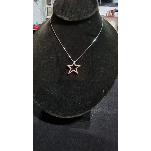 289 - 925 silver star pendant inset with 3 genuine diamonds on a 18in 925 silver chain in good condition b... 