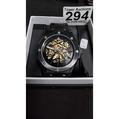 294 - Attractive Ralph Christian gents black automatic  watch with a brass skeleton dial on a metal link b... 