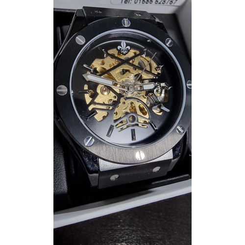 294 - Attractive Ralph Christian gents black automatic  watch with a brass skeleton dial on a metal link b... 