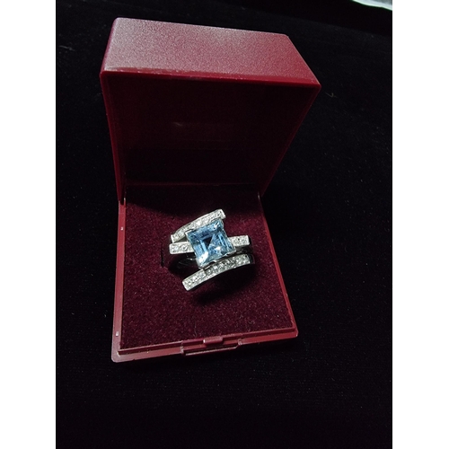 298 - Good chunky 18ct white gold ring inset with a large square cushion cut aqua marine stone to the cent... 