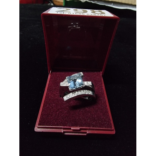 298 - Good chunky 18ct white gold ring inset with a large square cushion cut aqua marine stone to the cent... 