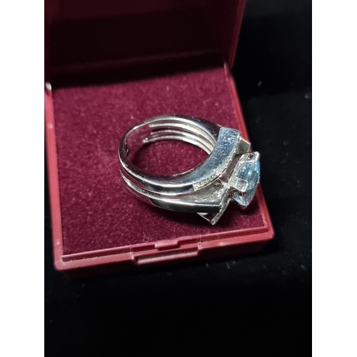 298 - Good chunky 18ct white gold ring inset with a large square cushion cut aqua marine stone to the cent... 