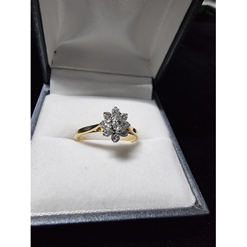 299 - Pretty hallmarked 18ct gold diamond cluster ring with a diamond to the centre surrounded by 8 smalle... 