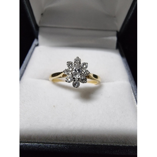 299 - Pretty hallmarked 18ct gold diamond cluster ring with a diamond to the centre surrounded by 8 smalle... 