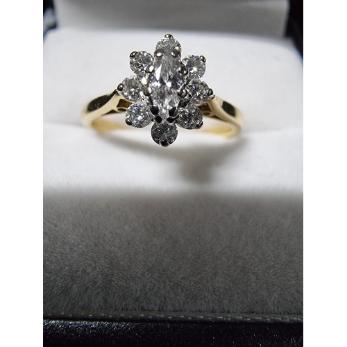 299 - Pretty hallmarked 18ct gold diamond cluster ring with a diamond to the centre surrounded by 8 smalle... 