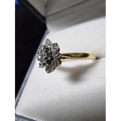 299 - Pretty hallmarked 18ct gold diamond cluster ring with a diamond to the centre surrounded by 8 smalle... 