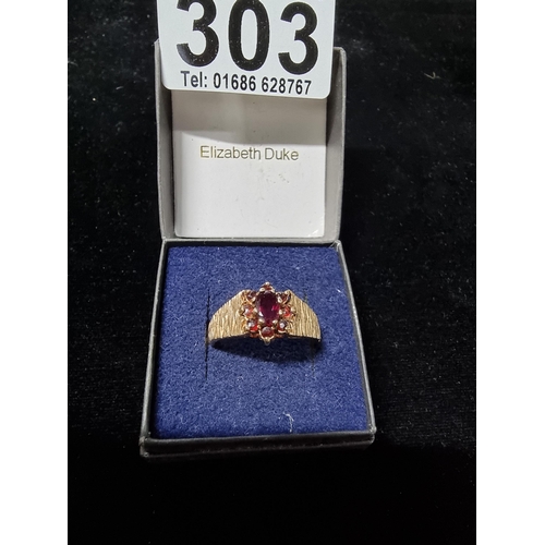 303 - 9ct Garnet cluster ring Size S 1/2 with bark effect ring band. total weight of 3.9 grams