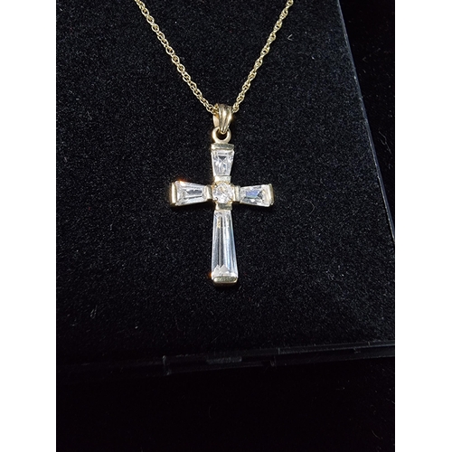 306 - 9ct gold crucifix pendant with clear crystal glass stones set on a 17in 9ct gold chain chain is mark... 