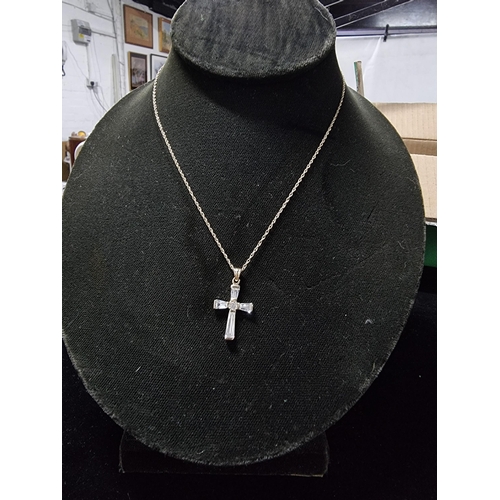 306 - 9ct gold crucifix pendant with clear crystal glass stones set on a 17in 9ct gold chain chain is mark... 