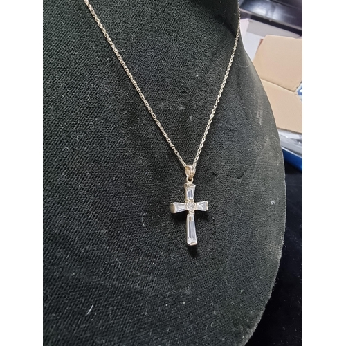 306 - 9ct gold crucifix pendant with clear crystal glass stones set on a 17in 9ct gold chain chain is mark... 