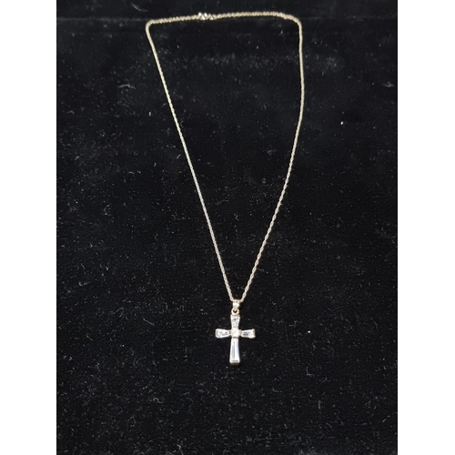 306 - 9ct gold crucifix pendant with clear crystal glass stones set on a 17in 9ct gold chain chain is mark... 