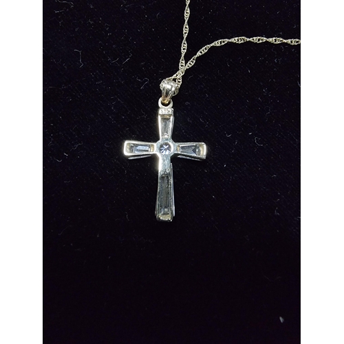 306 - 9ct gold crucifix pendant with clear crystal glass stones set on a 17in 9ct gold chain chain is mark... 