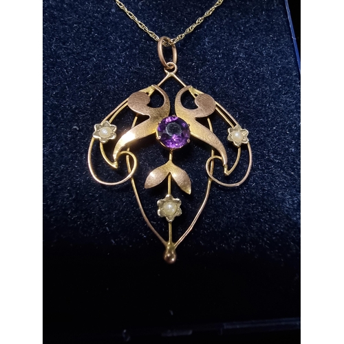 311 - Pretty vintage 9ct gold pendant inset with a large amethyst to the centre and 3 small split seed pea... 