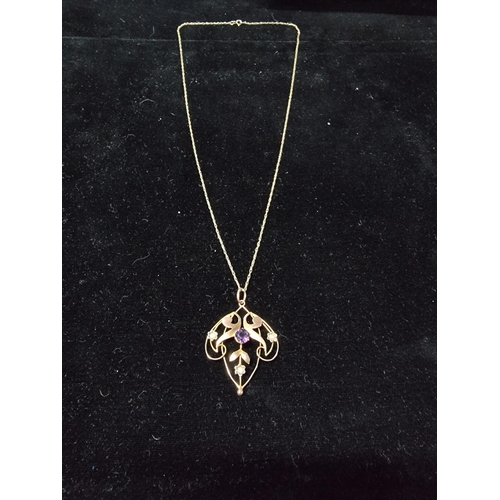 311 - Pretty vintage 9ct gold pendant inset with a large amethyst to the centre and 3 small split seed pea... 