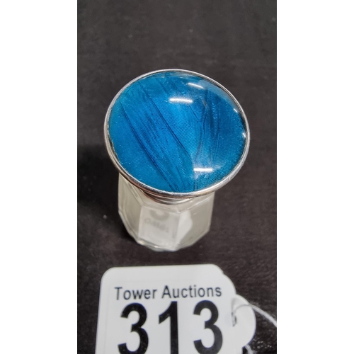 313 - Hallmarked silver topped glass scent bottle with a blue enamle top height 6cm width 3cm