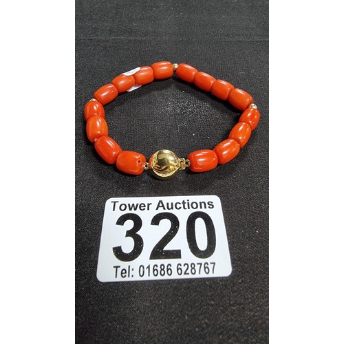 320 - Good quality coral beaded braclet hand knotted with a 9ct gold clasp and beads marked 375 JKA ( J.Ko... 