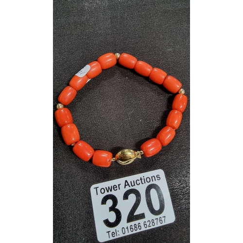 320 - Good quality coral beaded braclet hand knotted with a 9ct gold clasp and beads marked 375 JKA ( J.Ko... 