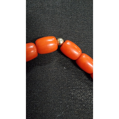 320 - Good quality coral beaded braclet hand knotted with a 9ct gold clasp and beads marked 375 JKA ( J.Ko... 