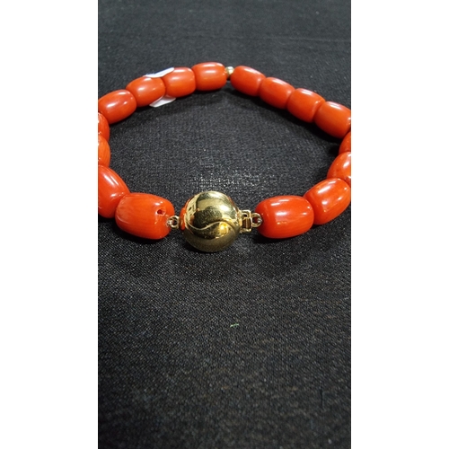 320 - Good quality coral beaded braclet hand knotted with a 9ct gold clasp and beads marked 375 JKA ( J.Ko... 