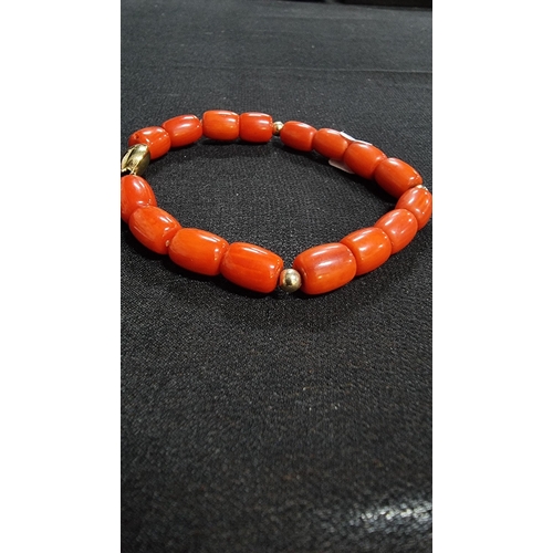 320 - Good quality coral beaded braclet hand knotted with a 9ct gold clasp and beads marked 375 JKA ( J.Ko... 