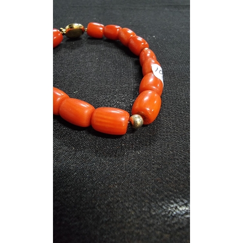 320 - Good quality coral beaded braclet hand knotted with a 9ct gold clasp and beads marked 375 JKA ( J.Ko... 