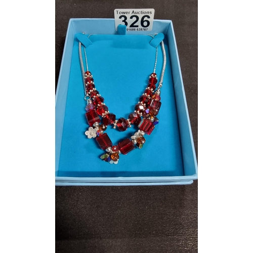 326 - 925 sterling silver necklace with red glass beads along with one other necklce with red glass beads