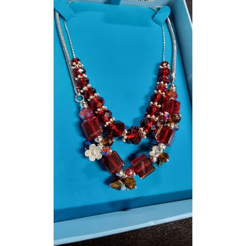 326 - 925 sterling silver necklace with red glass beads along with one other necklce with red glass beads