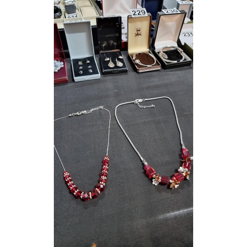 326 - 925 sterling silver necklace with red glass beads along with one other necklce with red glass beads