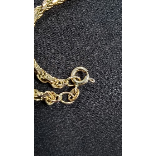 309 - A good 10ct gold Libra star sign pendant set on a chunky 9ct gold rope twist chain both in excellent... 