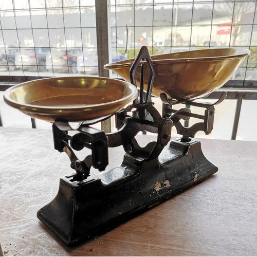 378 - Set of brass and cast iron vintage pan scales along with 6 brass weights