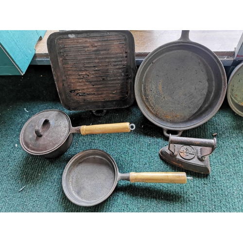 391 - Large quantity of cast iron saucepans, Skillets, antique iron etc, all are matching with wooden hand... 