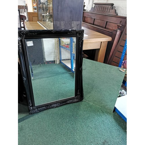 373 - 2x vintage bevelled Mirrors, one has a good quality vintage black frame. Largest one measures 89cm h... 