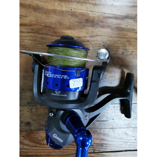Torrent Quantum 40, model TR40 fishing reel, contains a full spool of  fabric fishing line along with