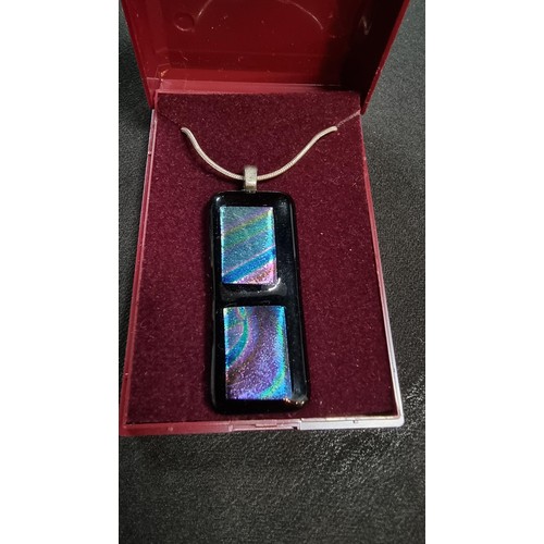 151 - Pretty Murano glass type pendant on a 18 inch 925 silver chain the glass pendant presents various co... 