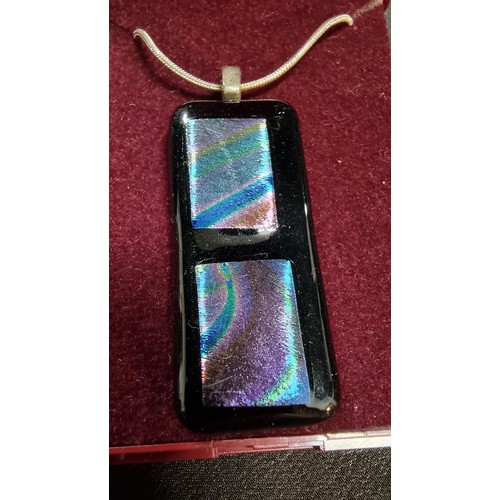 151 - Pretty Murano glass type pendant on a 18 inch 925 silver chain the glass pendant presents various co... 