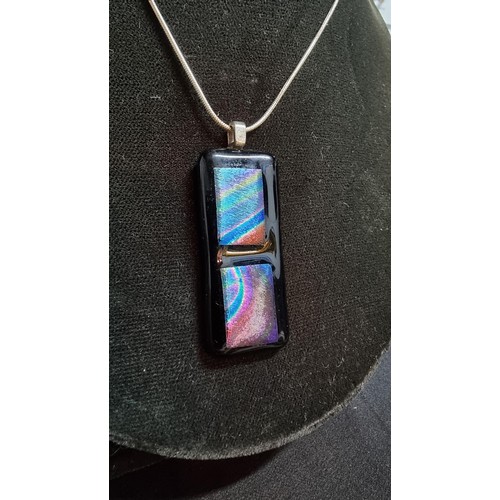 151 - Pretty Murano glass type pendant on a 18 inch 925 silver chain the glass pendant presents various co... 