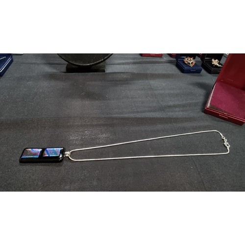 151 - Pretty Murano glass type pendant on a 18 inch 925 silver chain the glass pendant presents various co... 