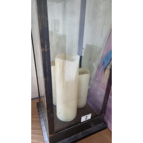 2 - Tall modern lantern with three battery powered candles  inside measures 70cm high