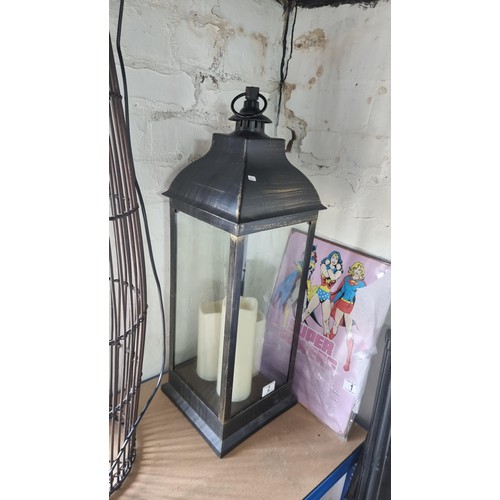 2 - Tall modern lantern with three battery powered candles  inside measures 70cm high
