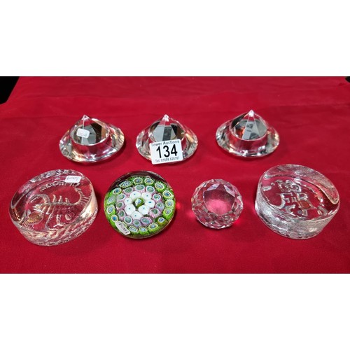134 - 4x glass paperweights, 2x by Dartington along with 3x glass diamond formed T-light holders