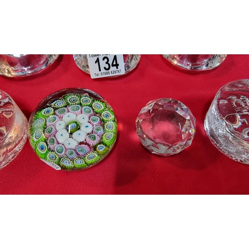 134 - 4x glass paperweights, 2x by Dartington along with 3x glass diamond formed T-light holders