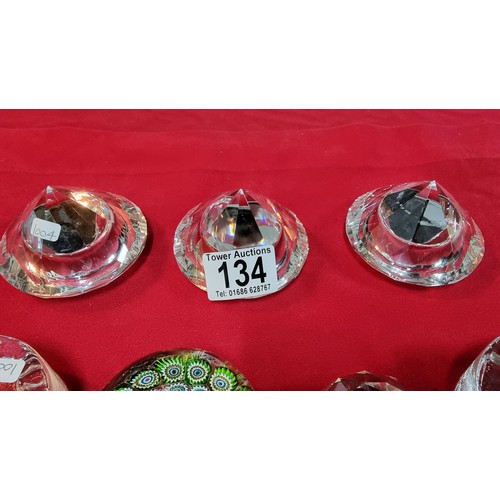 134 - 4x glass paperweights, 2x by Dartington along with 3x glass diamond formed T-light holders
