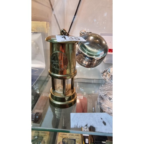 135 - Miniture brass minors lamp marked Ferndale Coal & Mining Co. Height of 12cm x diameter 5.5cm