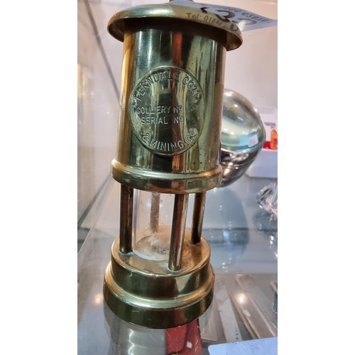 135 - Miniture brass minors lamp marked Ferndale Coal & Mining Co. Height of 12cm x diameter 5.5cm