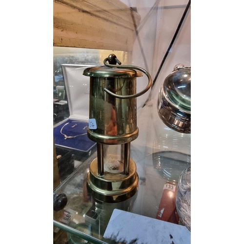 135 - Miniture brass minors lamp marked Ferndale Coal & Mining Co. Height of 12cm x diameter 5.5cm