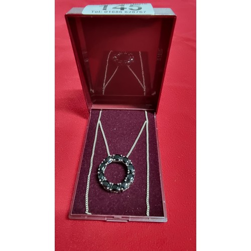 145 - 925 silver pendant inset with black tourmaline stones on a 16 inch 925 silver chain