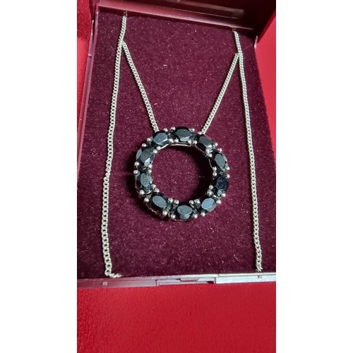 145 - 925 silver pendant inset with black tourmaline stones on a 16 inch 925 silver chain